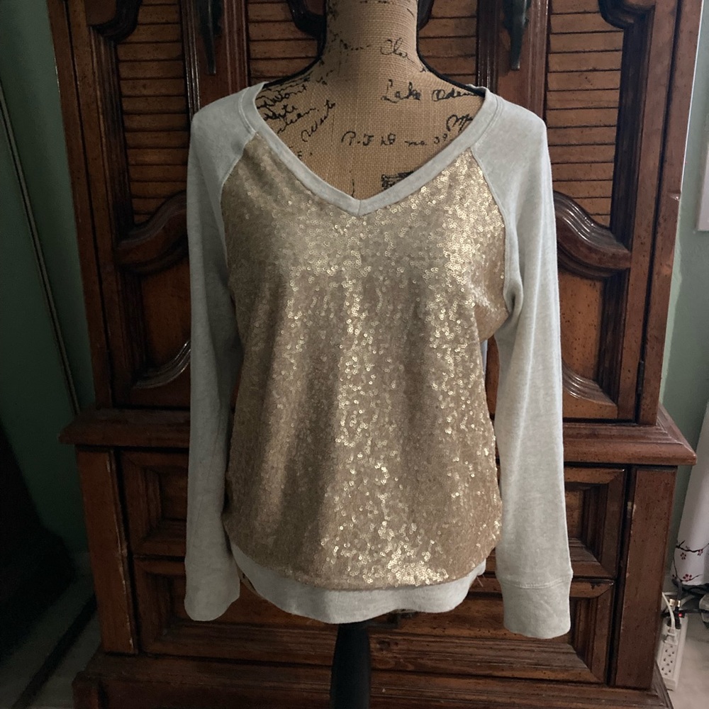 Gold long sleeve sequin top, size large.